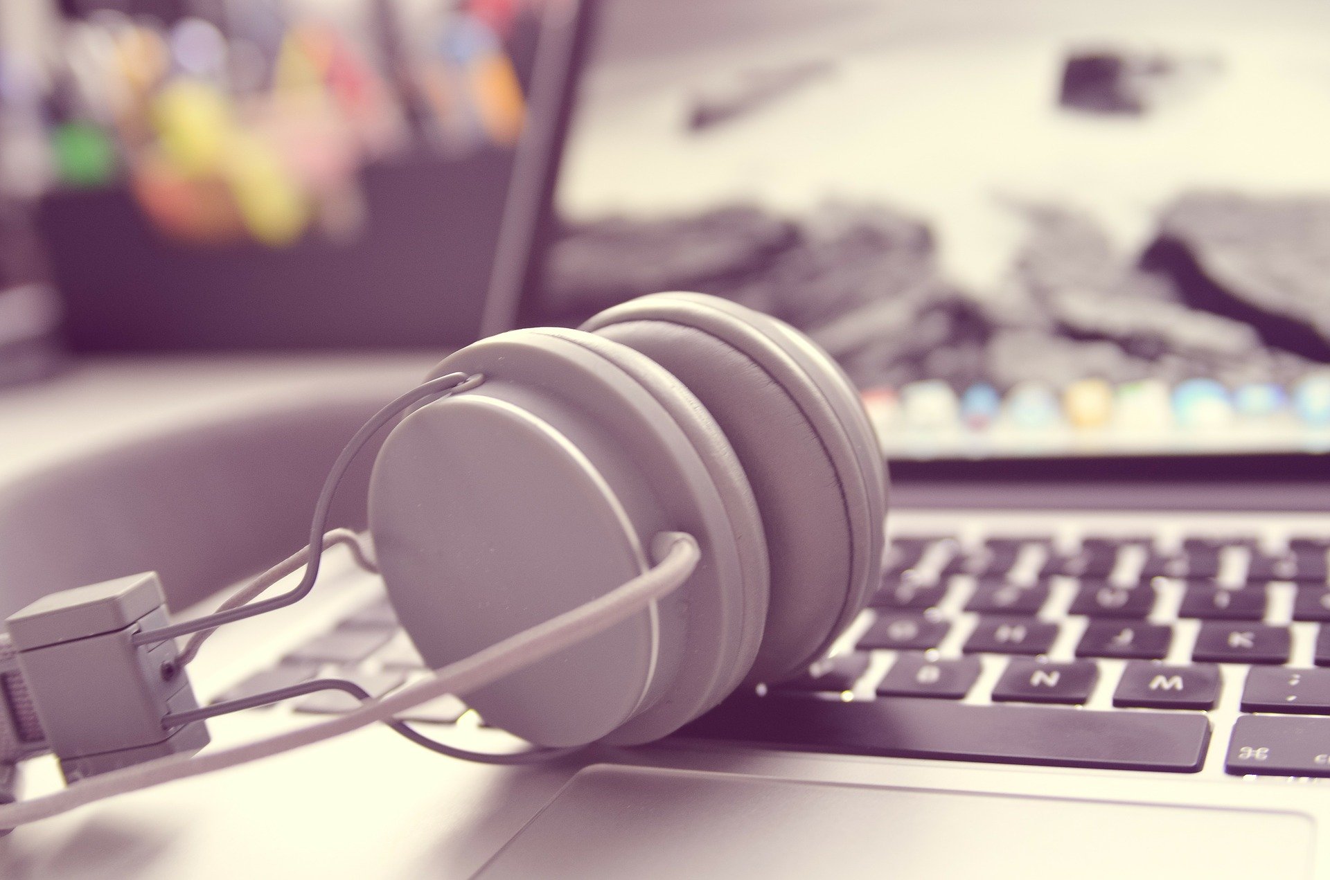 Image of a laptop and headphones